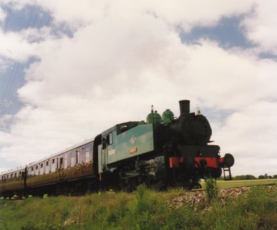 1997 - Kent & East Sussex Railway - Between Rolvenden & Tenterden - USA dock tank DS238 Wainwright